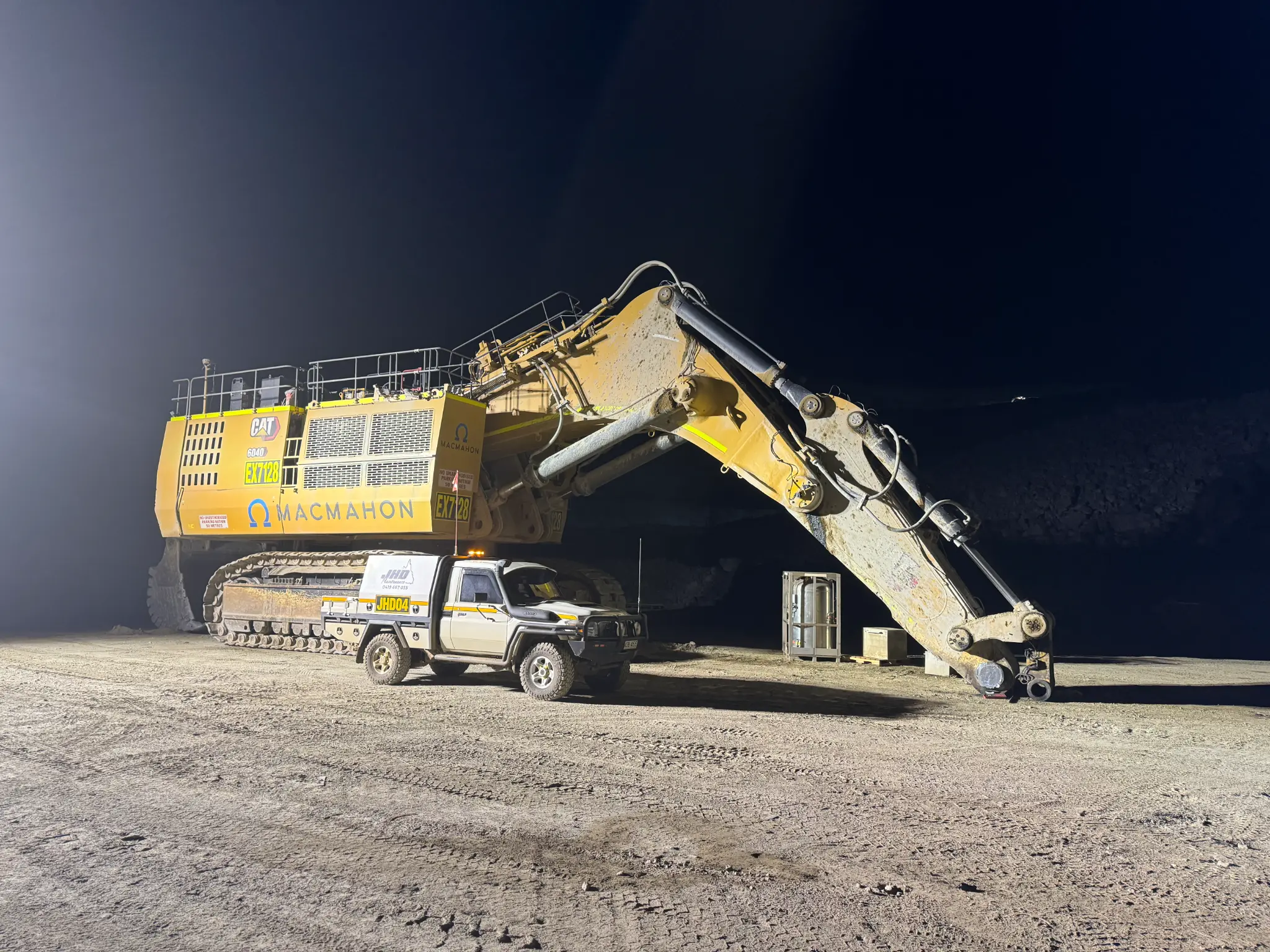 JHD Maintenance field service ute alongside CAT mining excavator at night — onsite mining equipment maintenance WA